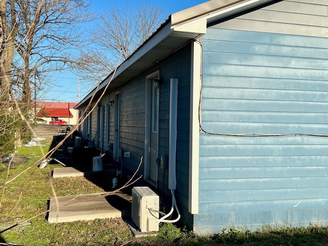 view of side of property with ac unit