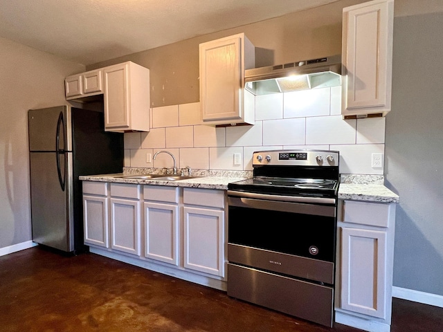 kitchen featuring decorative backsplash, white cabinets, appliances with stainless steel finishes, and sink