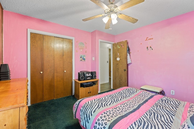 carpeted bedroom with a textured ceiling, a closet, and ceiling fan