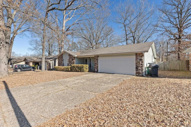 ranch-style house featuring a garage