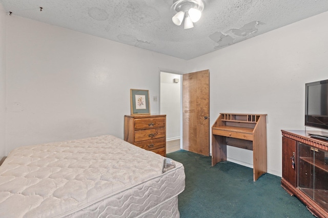 carpeted bedroom featuring a textured ceiling