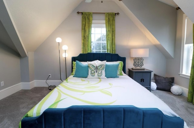 carpeted bedroom with vaulted ceiling