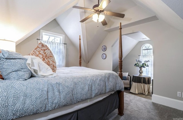 bedroom with ceiling fan, vaulted ceiling, and carpet