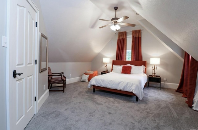 carpeted bedroom with ceiling fan and lofted ceiling