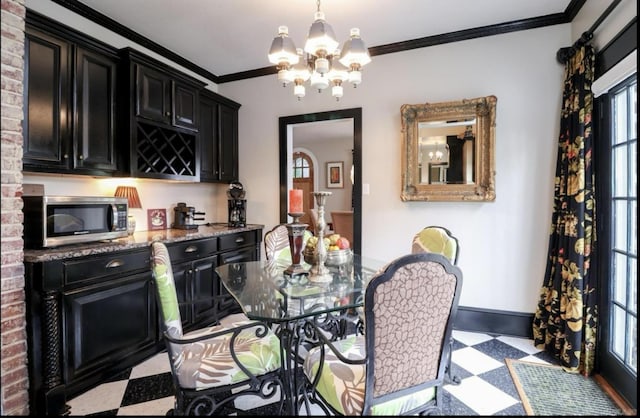 bar with decorative light fixtures, plenty of natural light, an inviting chandelier, and ornamental molding