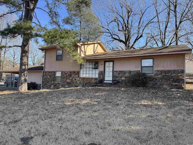 view of front of home with a carport