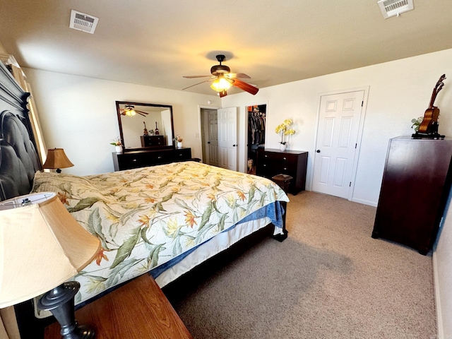 bedroom featuring a closet, ceiling fan, and carpet flooring