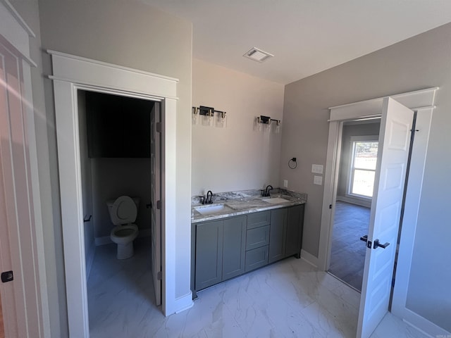 bathroom with vanity and toilet