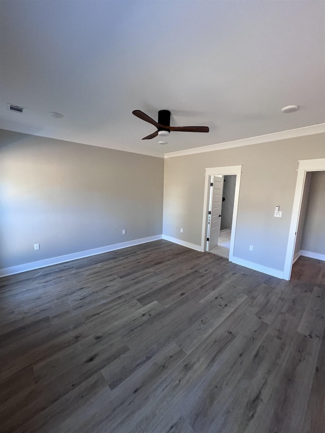 unfurnished room with ceiling fan, ornamental molding, and dark hardwood / wood-style floors