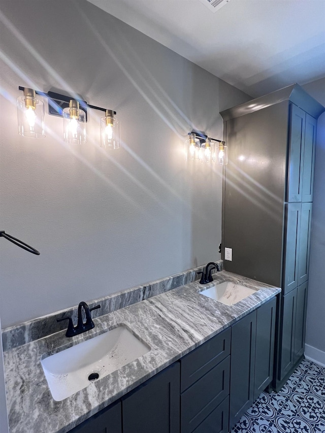 bathroom with vanity and tile patterned flooring