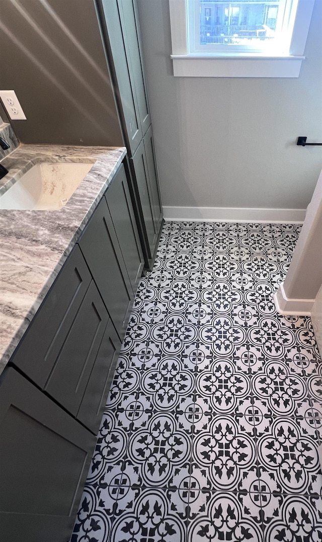 bathroom with vanity and tile patterned floors