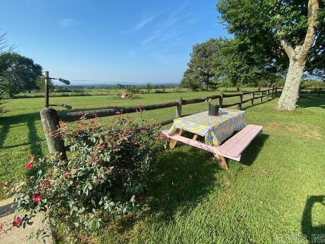 view of yard with a rural view