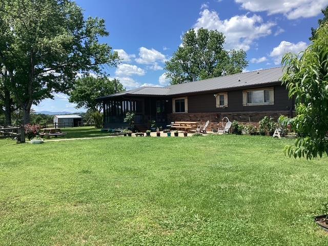 back of house with a yard