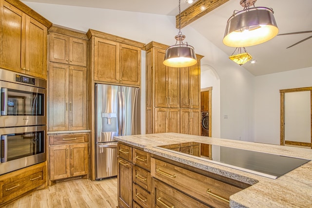 kitchen with light hardwood / wood-style floors, stainless steel appliances, vaulted ceiling with beams, light stone countertops, and pendant lighting