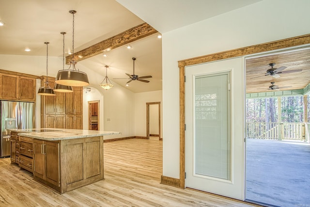 kitchen with stainless steel refrigerator with ice dispenser, ceiling fan, decorative light fixtures, lofted ceiling, and a kitchen island