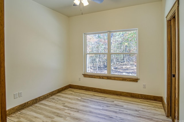 spare room with ceiling fan and light hardwood / wood-style flooring