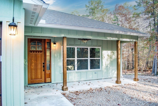 entrance to property featuring ceiling fan and covered porch