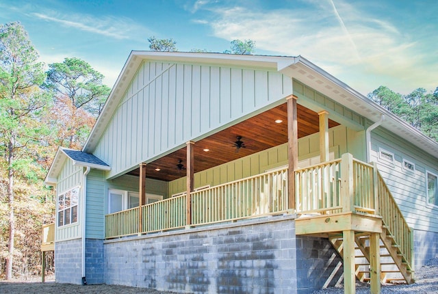 view of property exterior with ceiling fan and a balcony