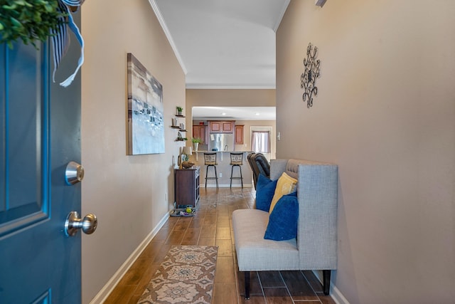 entryway featuring crown molding