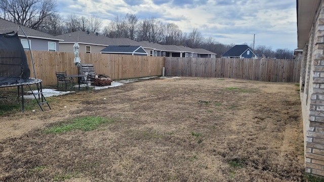 view of yard with a trampoline