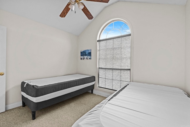 bedroom with vaulted ceiling, ceiling fan, and carpet flooring