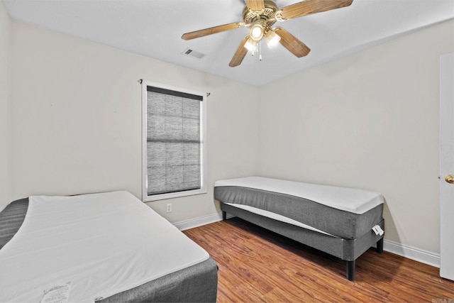 bedroom with ceiling fan and hardwood / wood-style floors