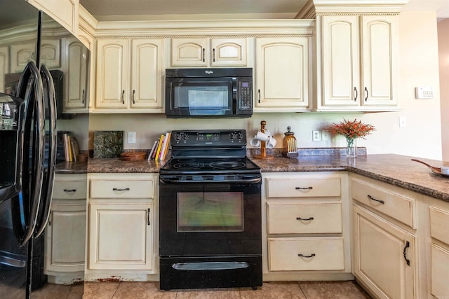 kitchen with black appliances, cream cabinets, and light tile patterned flooring