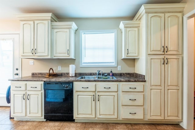 kitchen featuring light tile patterned floors, cream cabinetry, sink, and black dishwasher