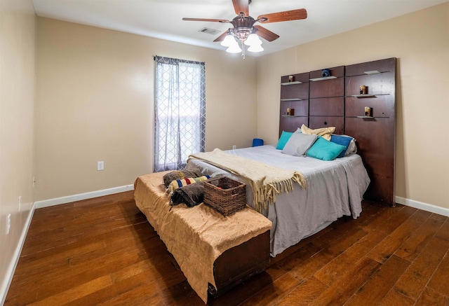 bedroom with ceiling fan and dark hardwood / wood-style floors