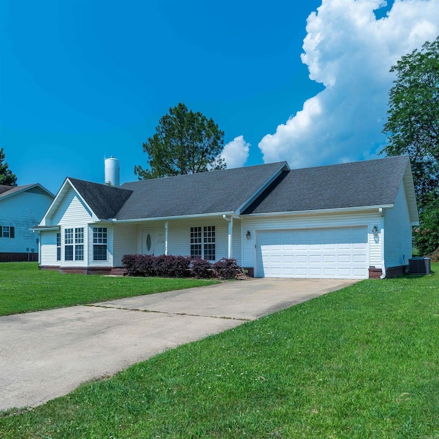 single story home with a garage, a front lawn, and central air condition unit