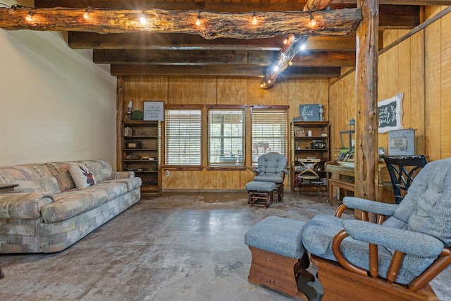 interior space featuring wood walls, beamed ceiling, and concrete flooring