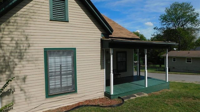 view of property exterior featuring a lawn