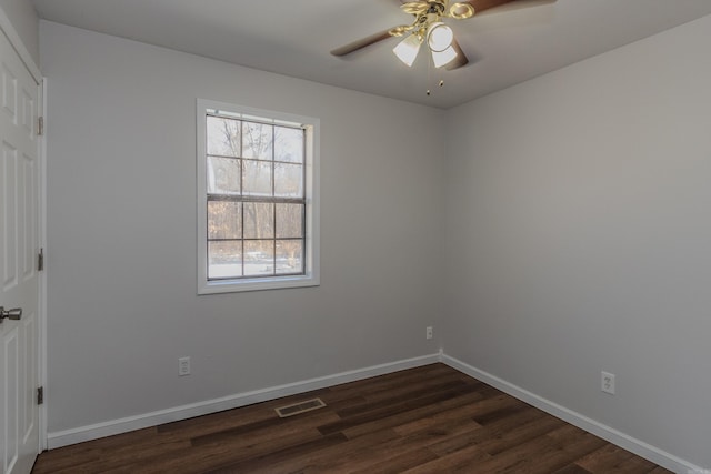 unfurnished room with ceiling fan and dark hardwood / wood-style floors