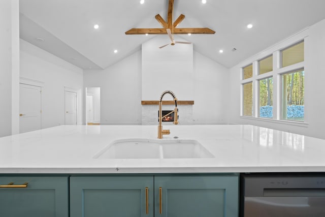 kitchen featuring lofted ceiling with beams, dishwasher, an island with sink, sink, and light stone counters