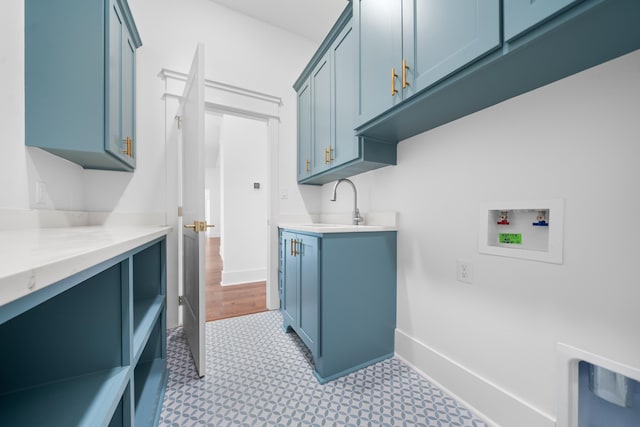 laundry area with cabinets, sink, and hookup for a washing machine