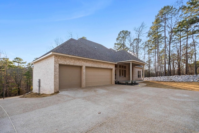 view of side of home featuring a garage