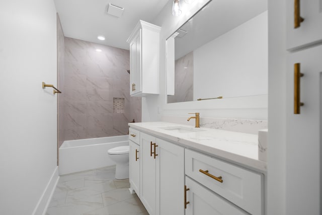 full bathroom with vanity, toilet, and tiled shower / bath combo