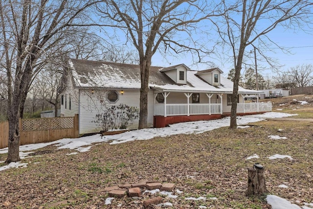 view of snow covered exterior with covered porch