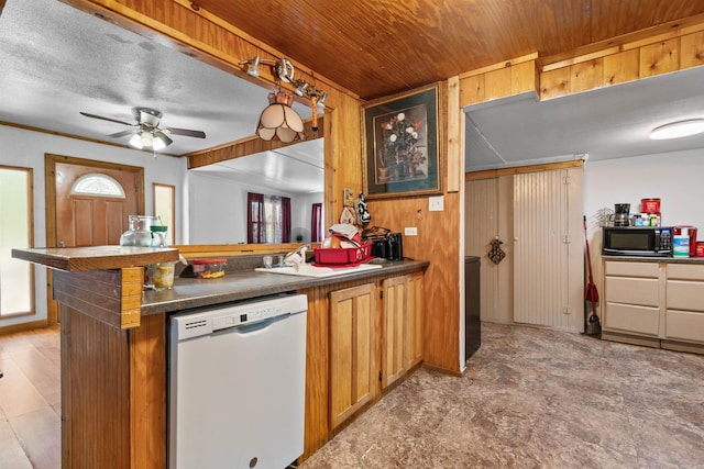 kitchen featuring ceiling fan, dishwasher, kitchen peninsula, sink, and wooden ceiling