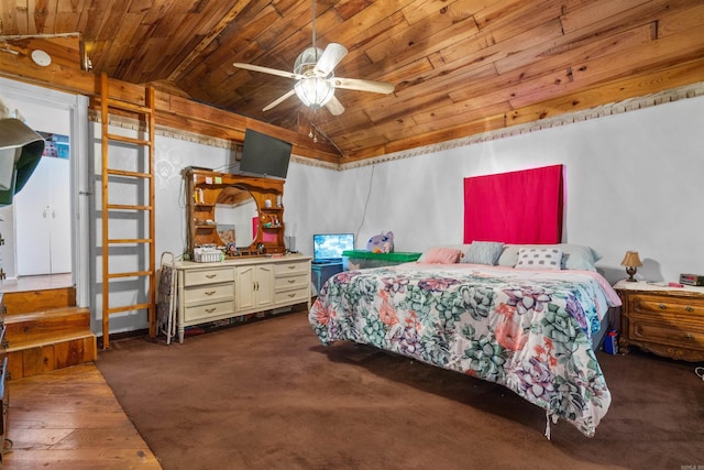 bedroom featuring ceiling fan, dark colored carpet, wooden ceiling, and lofted ceiling