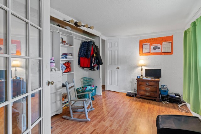 interior space featuring crown molding and hardwood / wood-style flooring