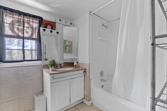 bathroom featuring vanity, tile patterned flooring, and shower / bath combo with shower curtain