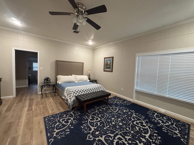 bedroom featuring ceiling fan, crown molding, and hardwood / wood-style flooring