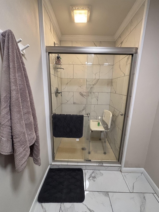 bathroom featuring an enclosed shower and crown molding