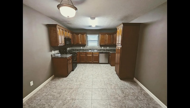 kitchen featuring black appliances, sink, dark stone countertops, and a textured ceiling