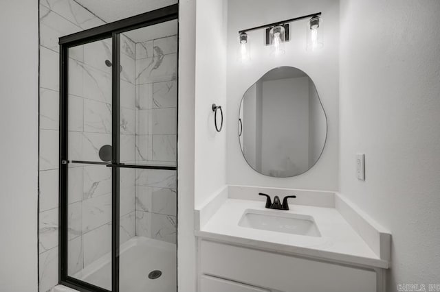 bathroom with an enclosed shower and vanity