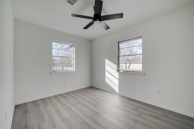 spare room featuring ceiling fan and light hardwood / wood-style floors