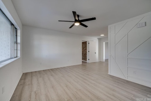 unfurnished room with ceiling fan and light hardwood / wood-style floors