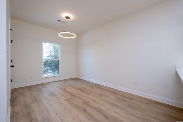 empty room with light wood-type flooring