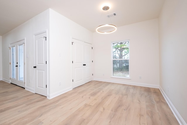 spare room with light wood-type flooring